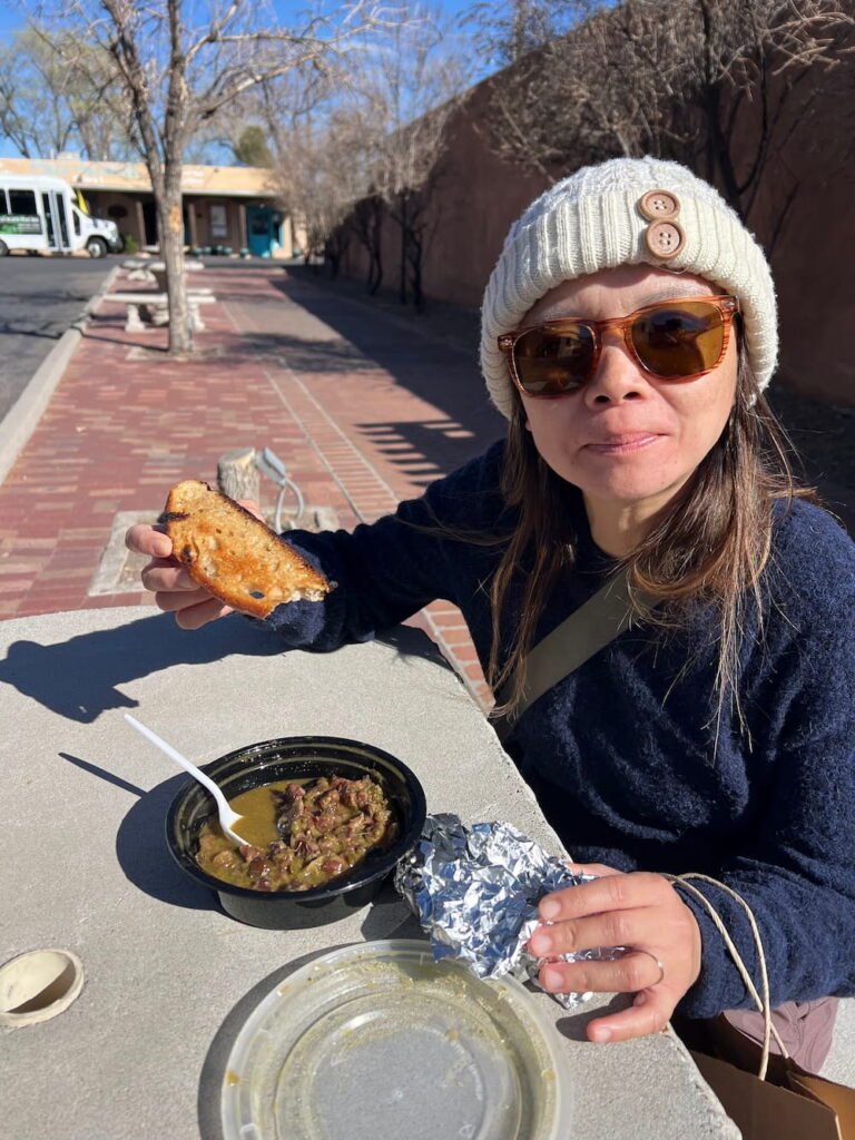 Lisette eating a vegan pozole