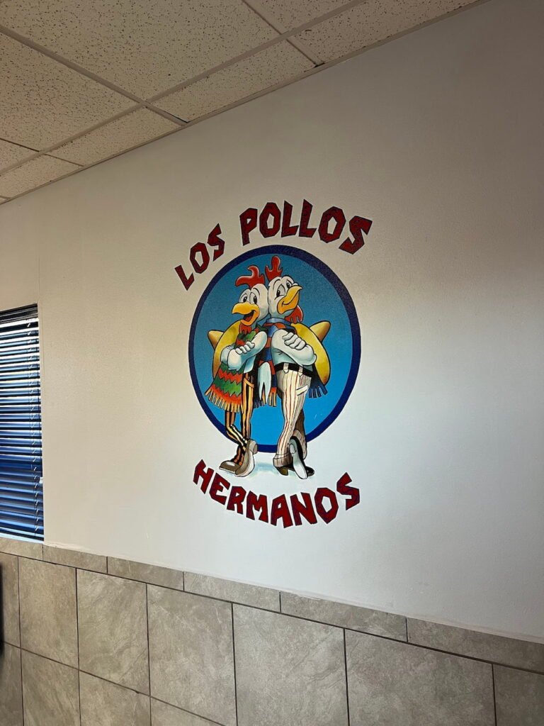Los Pollos Hermanos sign in the store