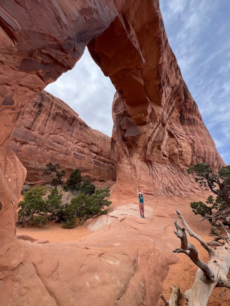 Lisette for scale at Pine Tree Arch