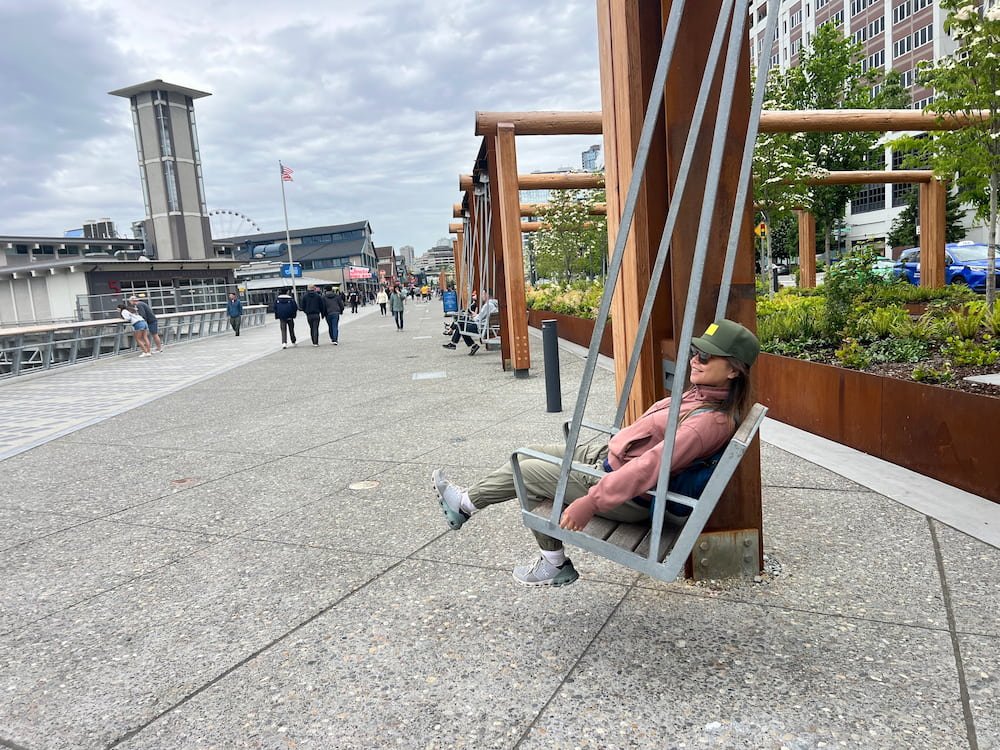 Lisette riding a swing in Seattle before the rain