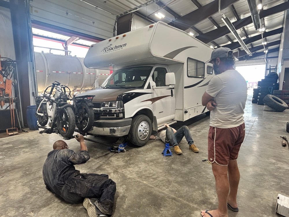 The guys checking our brakes