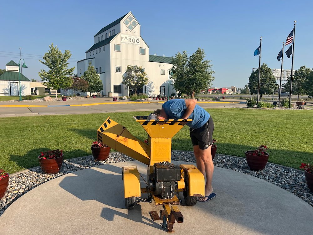 Michael with his head in the wood chipper