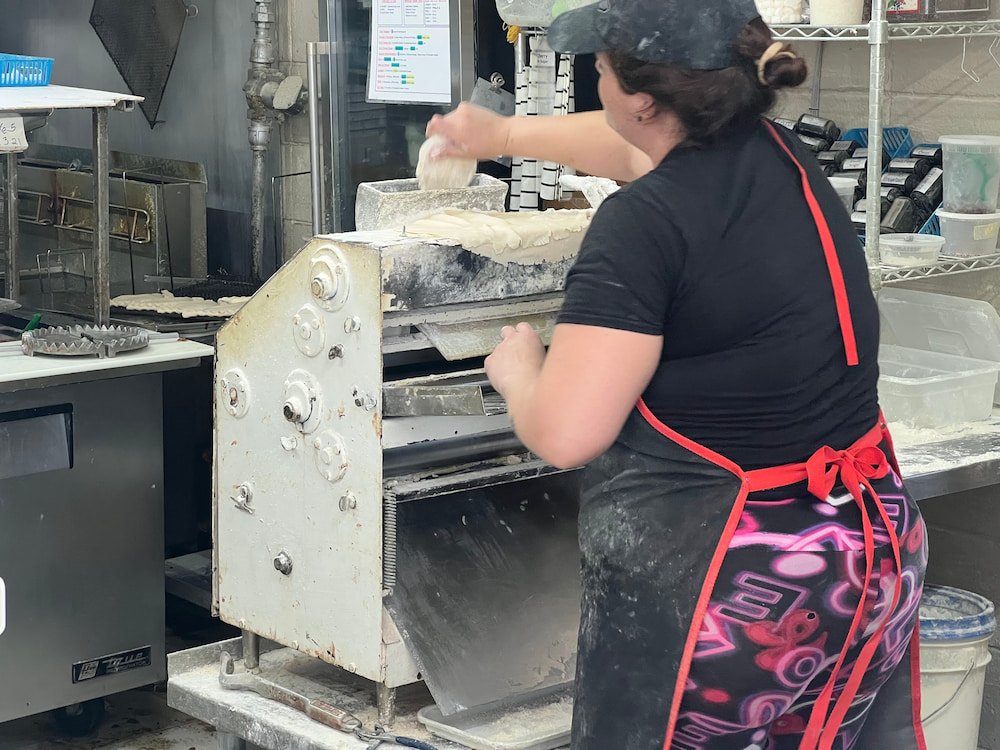 A worker making our fresh pies