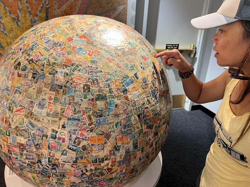 Lisette checking where each of the visible stamps were from