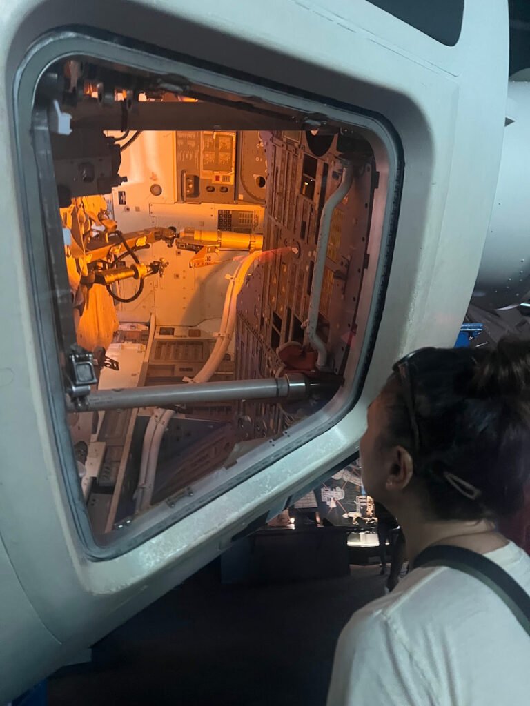 Lisette looking into one of the capsules