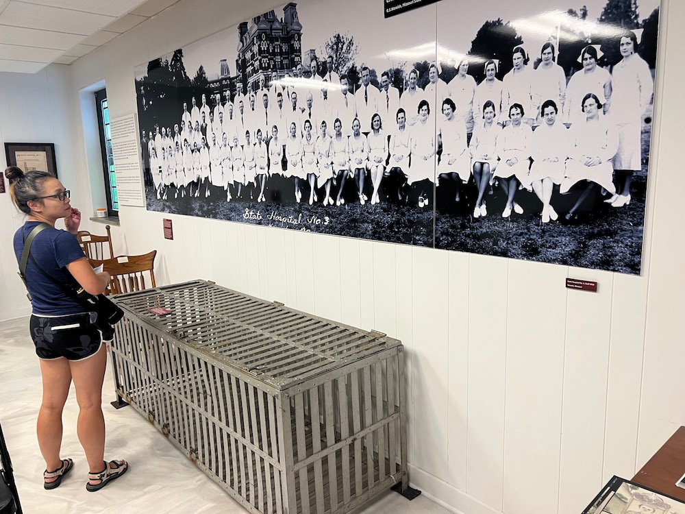 Staff at the State Hospital and a cage patients were put in