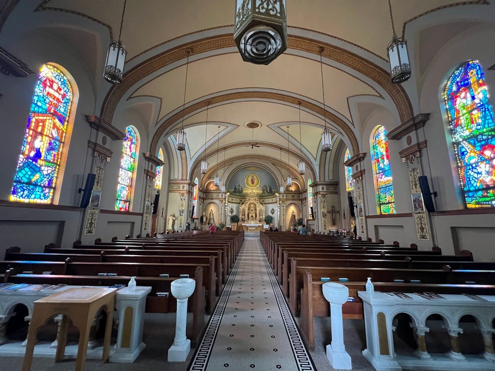 Stained glass windows shining inside the church