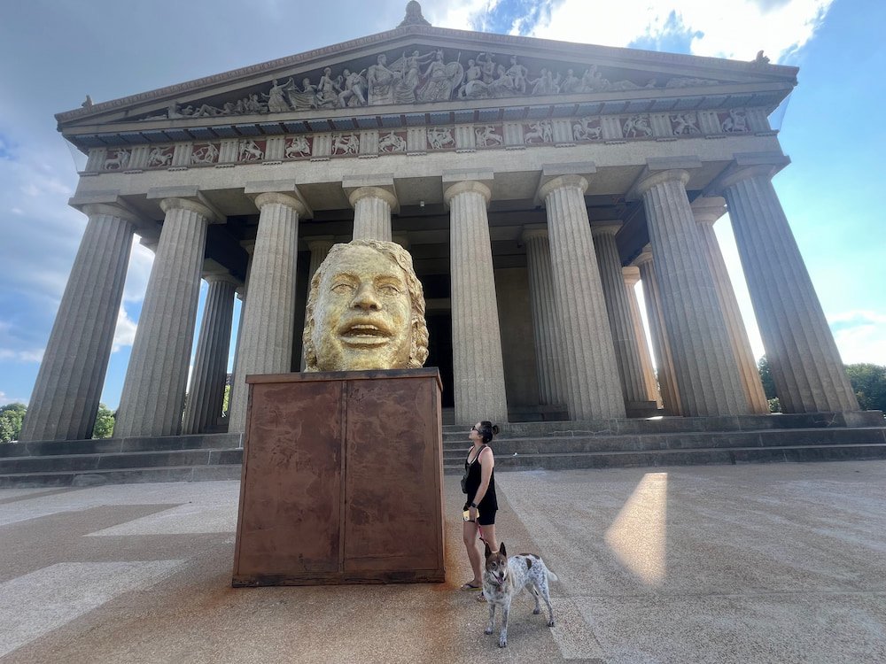 Giant gold head outside the Parthenon replica