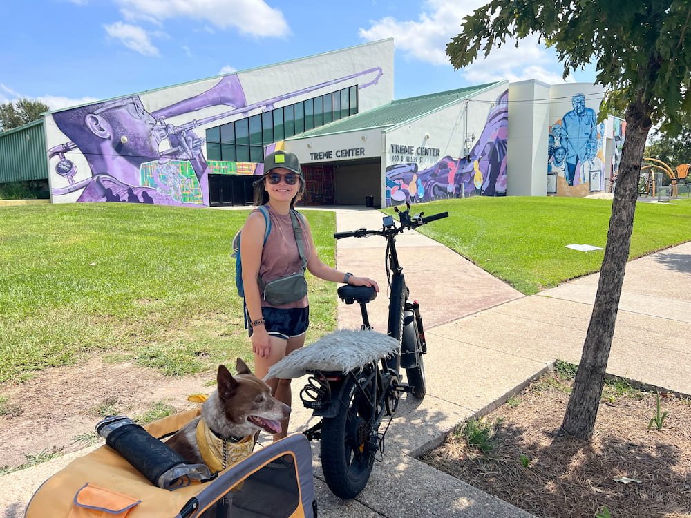 Lisette and Sheila on the bike with a nice mural in the back