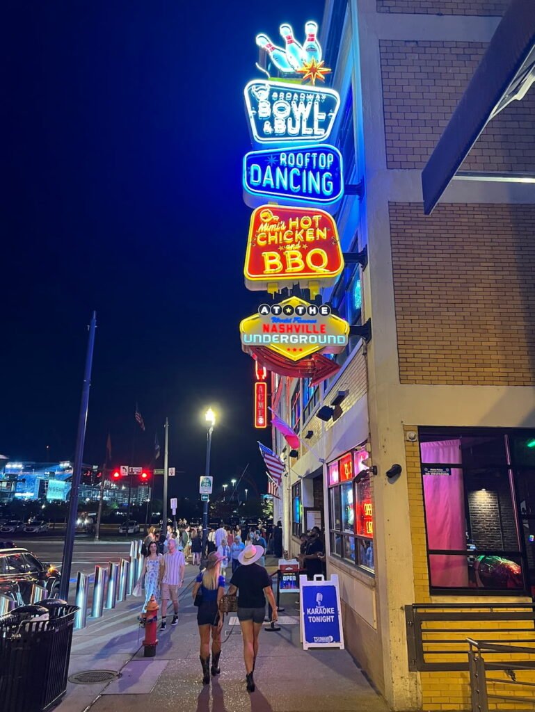 More neon and people wearing cowboy boots and hats