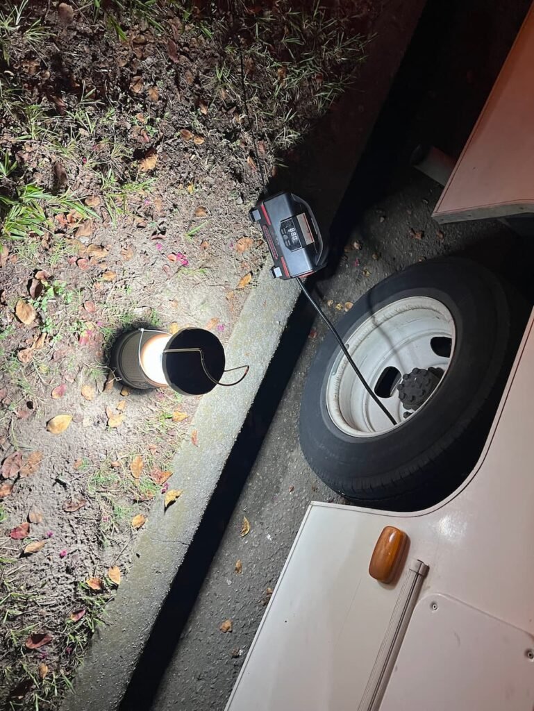 The second guy trying to inflate the tire