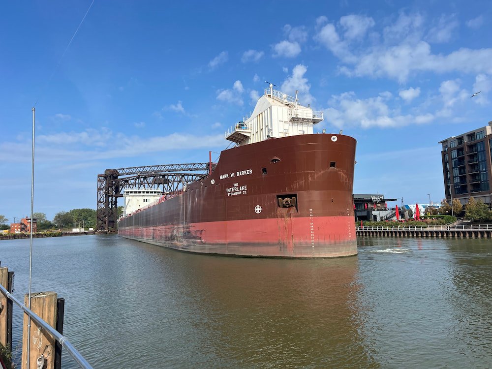 A giant tanker navigates the river