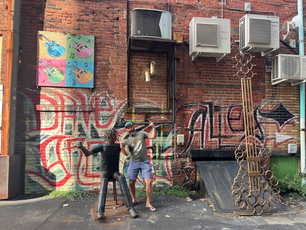 Michael rocking out with a statue of Dave
