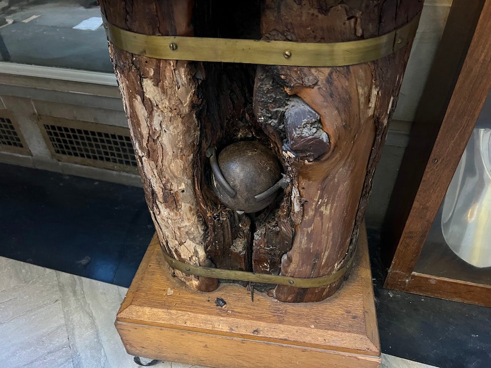 A cannonball stuck in some wood