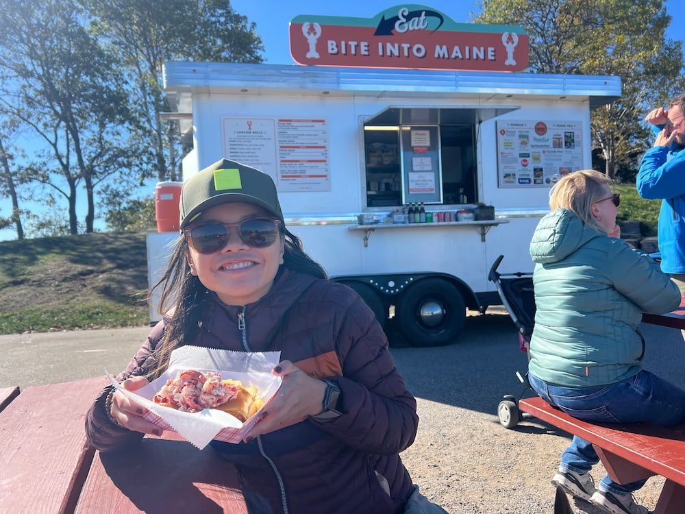 Lisette enjoying her lobster roll from Bite into Maine