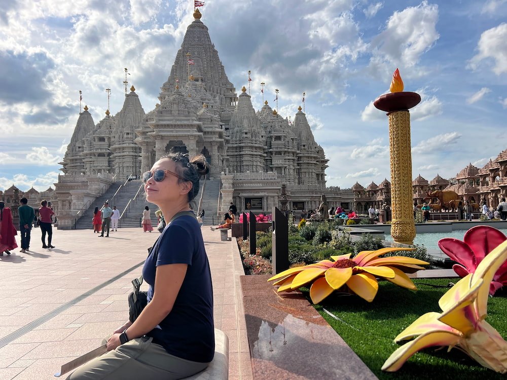 Lisette sitting with some of the Diwali decorations
