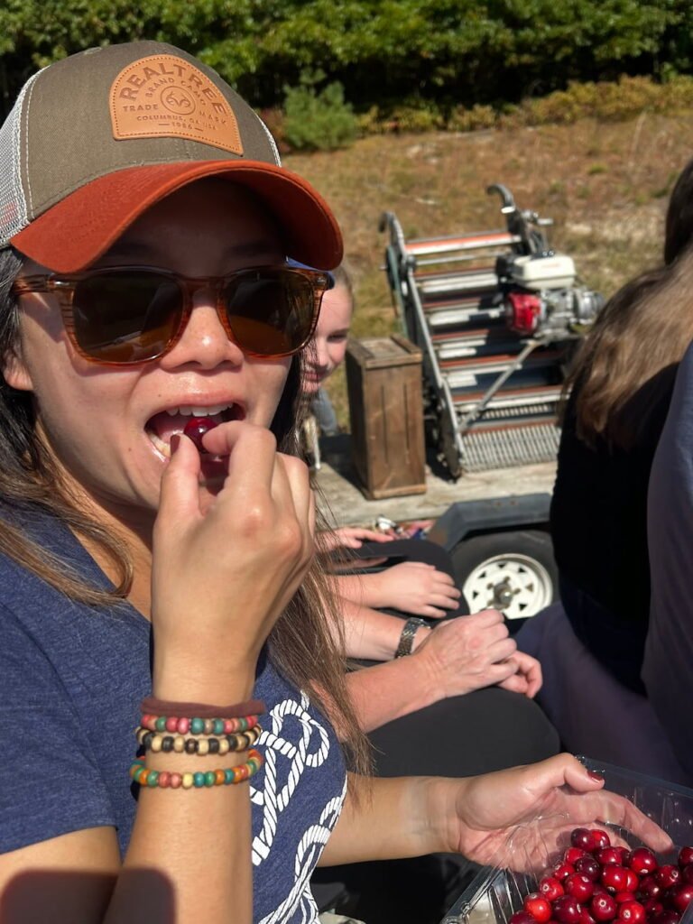 Lisette tasting a fresh cranberry