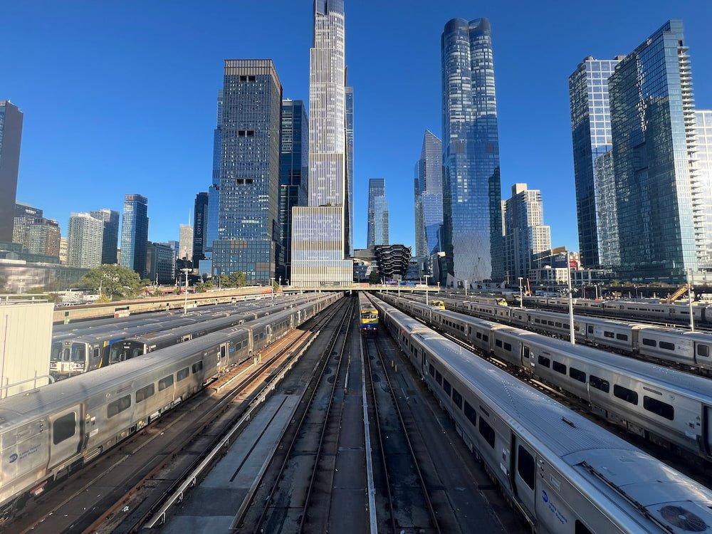 Walking along the High Line and looking down at all the trains