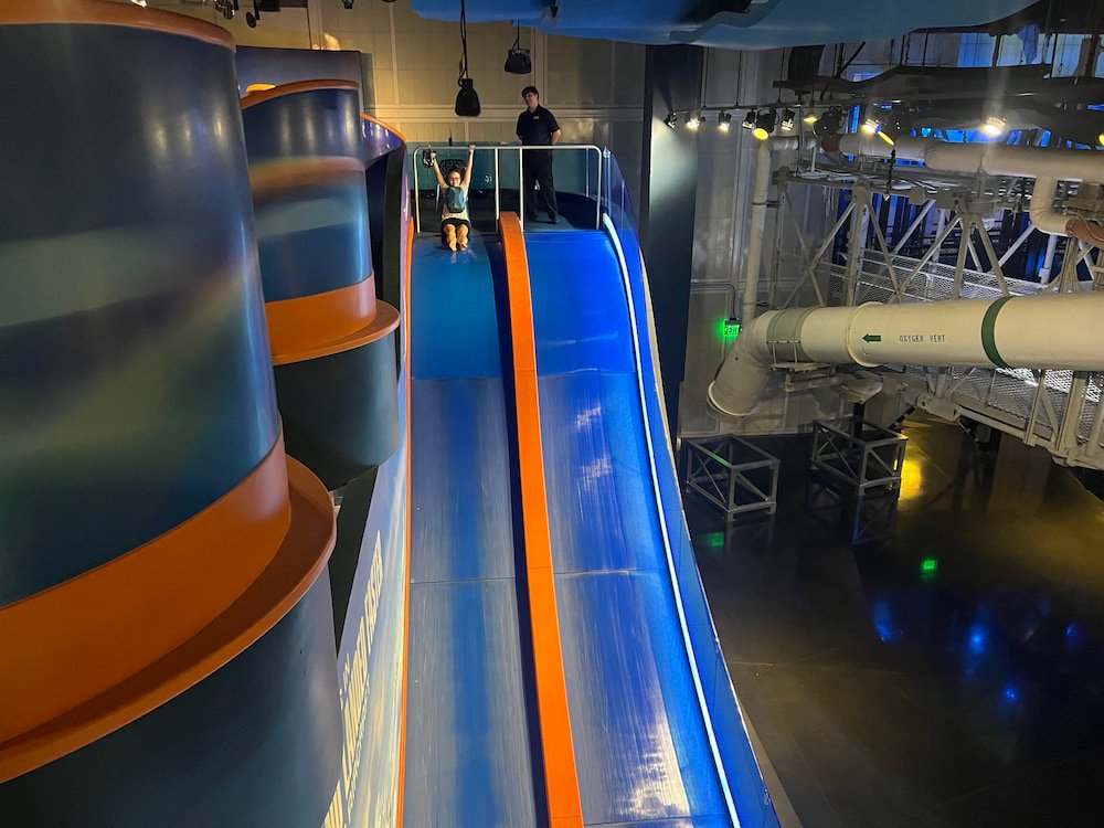 Lisette going down the slide