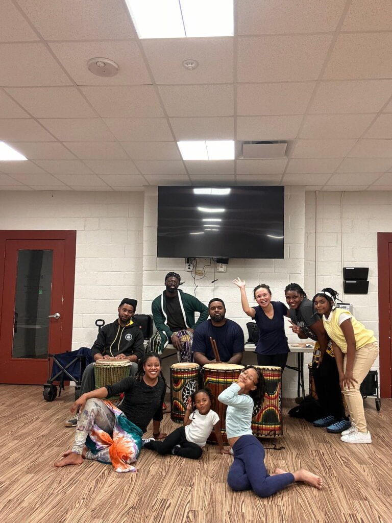 Lisette with the drummers and dancers